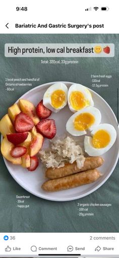 a white plate topped with eggs, fruit and sausage