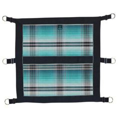 two plaid placemats sitting on top of each other, one in blue and the other in green