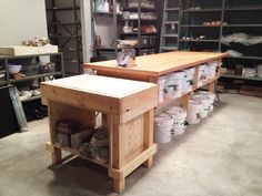 a workbench with several buckets on it