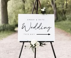 a welcome sign with white flowers on it