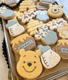 winnie the pooh cookies are arranged on a tray