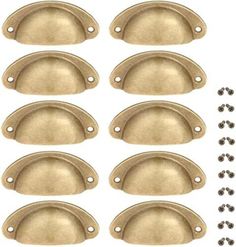 six brass oval knobs with holes in the middle