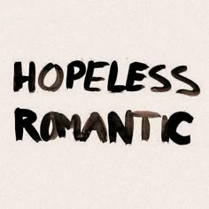 the word hopeless romantic written in black ink