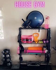 there is a gym rack with various items on it and the words house gym above it