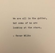 an old typewriter with a quote on it that says we are all in the gutter, but some of us are looking at the stars