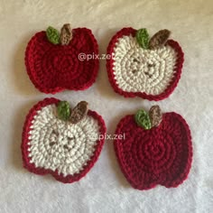 three crocheted apples sitting on top of a white table next to each other