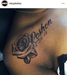 a woman's stomach with a rose tattoo on her side and the word behron written in cursive writing