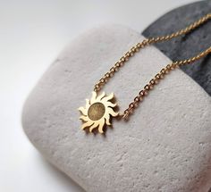 This amazing dainty sun necklace is such a great piece of every jewelry collection. The sunburst charm just brings good luck and happiness, good karma. This small gold sun pendant can be layered with other celestial necklace or worn on it's own. Pendant Size: 1.2 cm x 1.2 cm All my jewellery is lead and nickle free. I am attaching the minimalist sun charms on gold chain, which I cut to size to create something pretty just for you.   ✽ ENVIRONMENTAL FRIENDLY PACKAGE I was always feeling bad for creating more waste on this planet so I try to be environmental friendly everywhere where possible. All my wrapping material is biodegradable and recyclable :) My jewelry comes on A6 designed paper in a biodegradable cellophane bag which can either go to compost or landfills as it will disappear in a Dainty Sun And Moon Charm Necklaces As A Gift, Dainty Sun And Moon Charm Necklace For Gift, Dainty Sun And Moon Charm Necklace Gift, Dainty Sun And Moon Design Charm Necklace As Gift, Sun Design Pendant Jewelry As Gift, Sun Design Pendant Jewelry Gift, Sun And Moon Design Sunburst Jewelry Gift, Celestial Sun Design Necklaces For Gifts, Celestial Sun Design Necklaces As A Gift