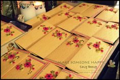 many cards are laid out on a table next to a candle and candlesticks