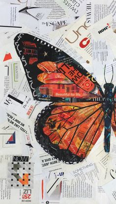 a butterfly is sitting on top of some newspaper pieces and it's wings are spread out