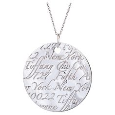 Stylish and finely detailed pre-owned Tiffany & Co large jumbo '727 Fifth Ave' medallion necklace, crafted in sterling silver. The necklace features a large jumbo medallion with repeating script that reads 'Tiffany & Co 727 Fifth Ave New York'. The Tiffany & Co chain measures 19 1/2 inches. The 'Notes' collection highlights the flagship store that has been located in New York since 1940. The necklace is in very good original condition and was recently professionally cleaned and polished. Particu New York Jewelry, Medallion Necklace, Tiffany And Co, Flagship Store, Necklace Silver, Yorkie, Tiffany & Co., Dog Tag Necklace, Silver Necklaces