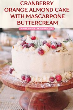 cranberry orange almond cake with mascarpone buttercream on a wooden platter