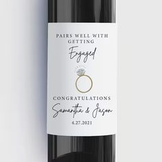 a bottle of wine with a wedding ring on the label that says, pairs well with getting engaged congratulationss