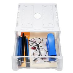 a clear plastic drawer with pens, pencils and other office supplies in it on a white background