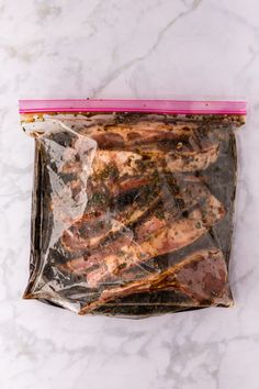 a bag of meat sitting on top of a marble counter