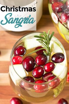 christmas sangria with apples, cranberries and rosemary garnish in glasses