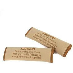 two wooden tubes with words on them