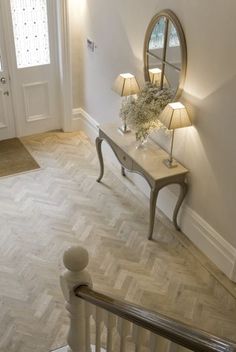 an image of a room with white walls and wood flooring on the web page