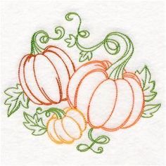 three pumpkins and two gourds on a white towel