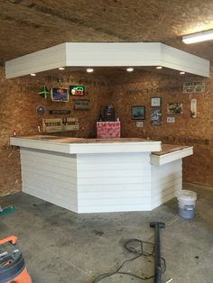 a white counter sitting inside of a garage