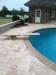 a pool with a bench next to it