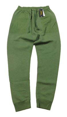 PLEASE NOTE: DUE TO HIGH VOLUME AND POST OFFICE DELAYS, DELIVERY TIMES MAY BE LONGER THAN NORMAL. ALL SALES ARE FINAL. NO RETURNS ACCEPTED. POLO RALPH LAUREN GREEN (MAY SAY BLUE ON TAG. IT IS A MANUFACTURER'S ERROR) DURABLE RIPSTOP PIECING AT THE WAIST AND POCKETS GIVES THESE JOGGER PANTS A RUGGED POLO RALPH LAUREN UPDATE APPROX. INSEAM: 27-½"; 12-½" RISE RIBBED CUFFS RIPSTOP DRAWSTRING WAISTBAND RIPSTOP PIECING AT THE POCKETS TWO BACK BUTTONED POCKETS TWO FRONT ANGLED POCKETS SHELL: 87% COTTON Green Cotton Sweatpants For Outdoor Activities, Green Cotton Sweatpants For Outdoor, Solid Color Cotton Sweatpants For Outdoor, Solid Cotton Sweatpants For Outdoor, Cotton Sweatpants For Outdoor, Ralph Lauren Green, Lauren Green, Fleece Joggers, Mens Green