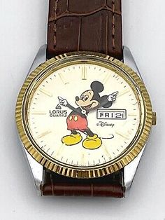 (eBay) Vintage Mickey Mouse Watch by Lorus, Day and Date, Stainless Steel Retro Brown Watch For Anniversary, Vintage Collectible Watch With Round Dial, Vintage Collectible Watches With Round Dial, Collectible Vintage Watches, Vintage Brown Watch For Anniversary, Vintage Brown Watch Accessories For Anniversary, Retro Analog-style Collectible Watch Accessories, Retro Watch Accessories With Subdials, Mickey Mouse Watch