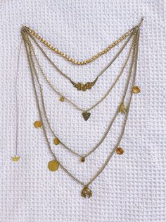 Design: Handmade layered necklace and charms One-of-a-Kind Metal: Brass Chain Measurements: 16" (shortest) - 38" (longest) Multi Strand Necklace, Layered Necklace, Brass Chain, Strand Necklace, Multi Strand, Earring Necklace, Gemstone Necklace, Layered Necklaces, Gemstone Earrings