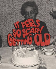 an older woman blowing out candles on a birthday cake with the words it feels so scary getting old