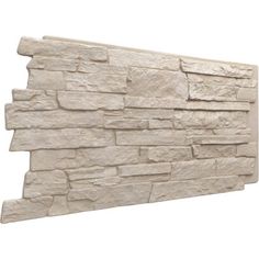 a stone wall that is made out of different types of stones and has a white background