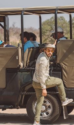 a man riding on the back of a golf cart