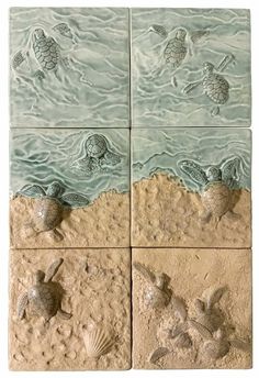 four tile panels with sea turtles and seashells on the bottom, in sand