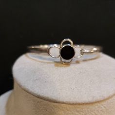 "Classic polished flat Silver Bangle featuring a 10mm round BLACK ONYX at the top, over a scalloped design. Flexes open and closed, with a tension catch (see photos) 5.2mm Wide 12.5 Grams 7.5\" (2 9/16\" across the bracelet interior) Hallmarked 925 THAILAND Contact me with any questions" Classic Adjustable Jewelry With Black Enamel, Adjustable Black Round Band Jewelry, Adjustable Round Onyx Bracelets, Classic Black Jewelry With Round Stone, Black Enamel Bracelets As Gift, Elegant Black Sterling Silver Bangle, Adjustable Round Bangle For Formal Occasions, Elegant Black Enamel Round Bracelets, Formal Adjustable Round Bangle