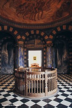 an ornately decorated room with painted walls and flooring is seen in this image