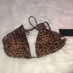 * Brand: South Beach * Condition: Brand New With Tags * Color: Black & Brown; Leopard Print * Features: Leopard Print Triangle Bikini Top With Removable Padding And Adjustable Straps And Circular Hooks For Support And Gold Emblems For That Right Touch. * Material: 82% Polyester, 18% Elastane; Lining- 100% Polyester * Size: Women’s Size 12 Ships From A Clean, Smoke-Free, Pet-Free Home. Shop My Commerce Profile Https://Www.Facebook.Com/Marketplace/Profile/11319245/?Ref=Permalink And Check Out My C Brown Halter Neck Swimwear, Brown Halter Neck Swimwear For Pool, Brown Halter Neck Swimwear For Summer, Summer Brown Halter Neck Swimwear, Fitted Brown Halter Top For Beach, Brown Swimwear With Built-in Bra For Pool, Leopard Print Swimwear For Vacation, Brown Tie-side Bottom Swimwear For Summer, Brown Triangle Halter Top For Beachwear