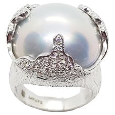 Mabe Pearl with Diamond 0.49 carat Ring set in 18 Karat White Gold Settings Width: 2.0 cm Length: 2.0 cm Ring Size: 53 Total Weight: 17.67 grams "We first opened doors in 1980 when it was then situated in the vicinity of the Victory Monument; a small and modest storefront with a couple of counters. From its humble beginnings to where it stands today, our company has proven its abilities as a jeweler. Since the beginning, we have been supplying fine quality pieces to dealers, wholesalers and cust Diamond Ring Set, Pearl And Diamond Ring, Mabe Pearl, Humble Beginnings, Bluish Gray, Diamond Ring Settings, Pearl Diamond, Ring Set, Pearl White