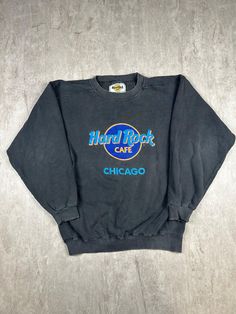 Embrace the nostalgia with our Vintage 90s Hard Rock Cafe Chicago Crewneck Sweatshirt. Made in the USA, this men's size M sweatshirt features the iconic Hard Rock Cafe logo, making it a must-have for fans and collectors of classic memorabilia. Please refer to the provided pictures for a detailed view of the condition and measurements of this item. We strive to present our pieces as accurately as possible, ensuring you have a clear understanding of their fit and wear. We put in our best efforts to clean and remove any stains, marks, etc. from our vintage pieces, but due to the nature of these items, some imperfections may remain. If you have any questions or require additional pictures, please don't hesitate to reach out to us! Casual Sweatshirt With Logo Print For Fans, Casual Sweatshirt With Band Logo For Winter, Casual Fall Sweatshirt With Band Logo, Retro Sweatshirt With Lettering For Streetwear, Casual Band Logo Sweatshirt For Streetwear, Casual Crew Neck Sweatshirt For Concert, Casual Letter Print Sweatshirt For Concert, Casual Band Logo Sweatshirt For Fans, Casual Crew Neck Sweatshirt With Band Logo