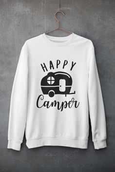 Stay warm and stylish on your adventures with our 'Happy Camper' crewneck sweatshirt. Perfect for those crisp mornings and chilly nights in your camper, this sweatshirt is crafted from soft, durable fabric to ensure maximum comfort and longevity. Featuring a cheerful 'Happy Camper' graphic, it’s an ideal addition to your travel wardrobe, celebrating your love for the open road and the great outdoors. Whether you're sipping coffee at sunrise or sharing stories around the campfire, this cozy crewn Outdoorsy Gifts, Around The Campfire, Gifts For Campers, Camper Life, Camping Outfits, Travel Wardrobe, Happy Camper, Open Road, Happy Campers