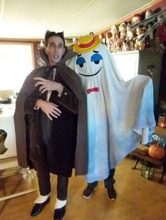 two people in costumes standing next to each other