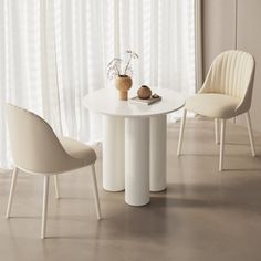 a white table with two chairs next to it