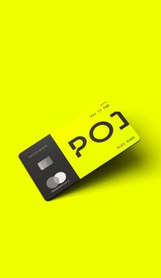 a credit card with the word pop printed on it, against a bright yellow background