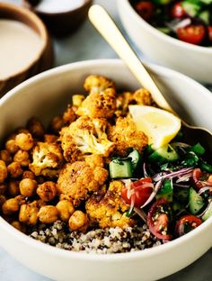 two bowls filled with different types of food