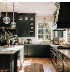 a kitchen with dark green cabinets and white counter tops is featured in this article by interior stylist