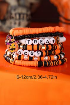 the bracelets are stacked on top of each other and have beads with words that say treat