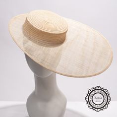 Flat top modeling sinamay millinery blank fascinator bases (not a regular hat) are made from the combination of Crushable Wide Hemp Braid sewn crown and flat stiffened sinamay oval shape brim.  It is great for creating fascinators or millinery hats. This sinamay frame is for hat making. Please note, this is a fascinator base with 2in deep shallow crown, it come with elastic to hold it on your head.  Comb or headband sold separately.   THIS IS NOT A READY-TO-WEAR item, you may need to add hat-fitting accessories like a comb or elastic for proper wearing on your head.  Accessories for combs or elastic bands are sold separately. Material: 100% Hemp / Sinamay Straw Crown Top: 6 inch Crown Deep: 2 inch Brim size: Long side 7 1/2 inch, Short Side 2 inch Made in Philippines Flat Fascinator Hat, Hemp Hat, Guest Ideas, Sinamay Fabric, Derby Outfits, Blank Hats, White Veils, Millinery Supplies, Bridal Hat