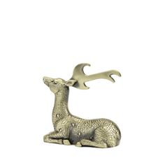 a silver deer figurine with antlers on its head and tail sitting down