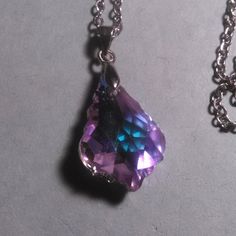 This Sparkly Pendant Necklace Features A Purple Colored Austrian Crystal In A Teardrop Shape. Many Faceted Cuts In The Piece Reflect A Lot Of Light. The Pendant Is In Silvertone, And The Chain Is Stainless Steel. The Chain Is Just Under 20 Inches In Length. Brand New. Silver Teardrop Crystal Necklace For Party, Silver Teardrop Pendant Crystal Necklace For Party, Purple Crystal Necklace, Sterling Silver Locket, Moissanite Necklace, Crystal Pendant Necklace, Black Bead Necklace, Emerald Necklace, Purple Crystal