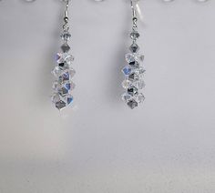 "Sparkling Swarovski crystal earrings made with 6mm Swarovski crystals (shown in Comet Argent & Clear AB - Available in all colors). Your choice of sterling silver earrings: French hooks, leverbacks or posts. Earrings as shown are 2\" long below the earwire. ** Comes boxed and ready for gift giving. Available in all colors. Shown in Swarovski Crystal Comet Argent with Clear AB. Available with 1 or 2 colors - convo me with your ideas. **I can make these earrings from 1.25 inches long to almos Swarovski Crystal Earrings, Hanging Earrings, 1 Or 2, Chandelier Earrings, Crystal Earrings, 2 Colours, Swarovski Crystal, Sterling Silver Earrings, Bead Work