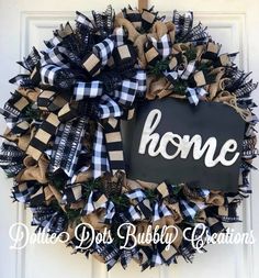 a black and white wreath with the word home on it