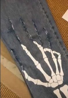 a piece of cloth with a skeleton painted on it